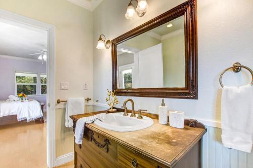 a bathroom with a sink and a mirror at Stylish Vineyard Living at Winemakers Estate in Windsor