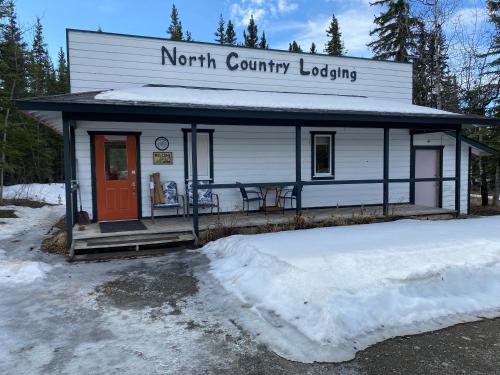 a north country looking building with snow around it at Burnt Paw in Tok