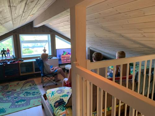 a group of children sitting in a bunk bed at Sunny Side in Hvaler