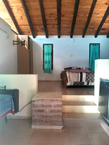 a room with two beds in a room at Cabaña en Jardines Santa Oliva in Ciudad Lujan de Cuyo
