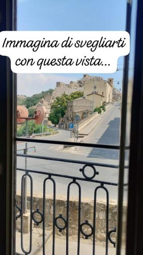 a view of a city street from a window at Nino's House in Sperlinga