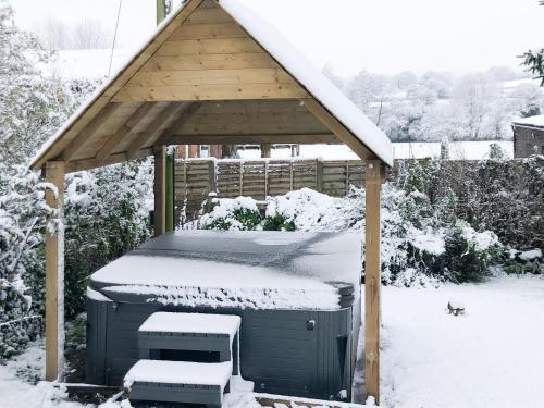 a gazebo with snow on top of it at New House Farm Annexe in Neenton