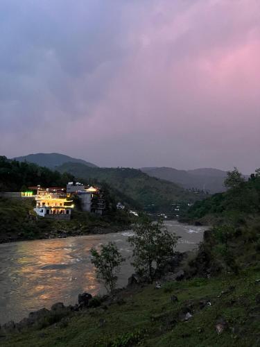 a view of a river with houses on a hill at Escaven - Your escape to Heaven 