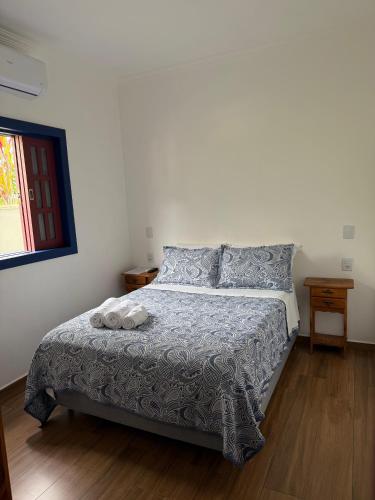 Ένα ή περισσότερα κρεβάτια σε δωμάτιο στο Pousada Casa Cota