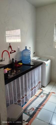 a kitchen with a sink and a counter top at Lorena in Ananindeua