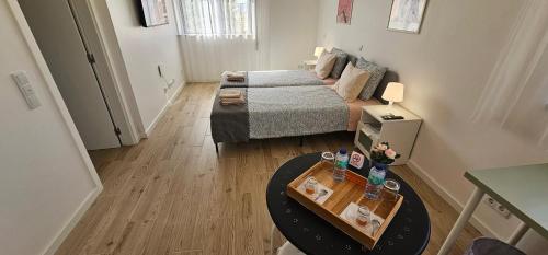 a living room with a couch and a table at Ideal Bubble House in Faro