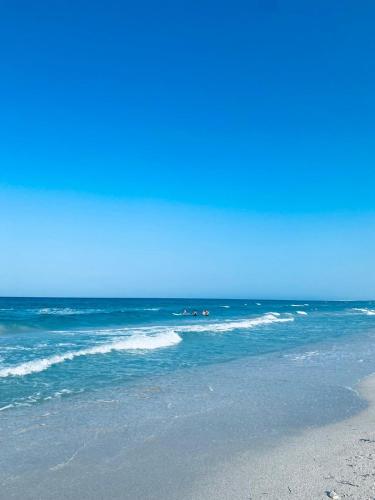a beach with the ocean in the background at Résidence in Sousse