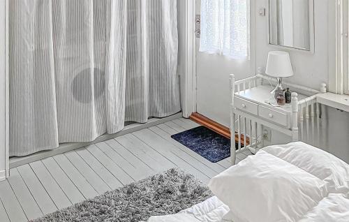 a white bedroom with a bed and a window at 3 Bedroom Gorgeous Home In Mellbystrand in Mellbystrand