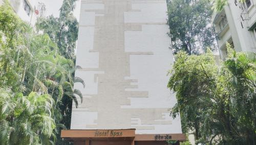 a building with a cross on the side of it at Hotel O Span Executive in Pune