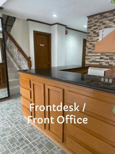a front desk with the words fundraising front office at Subic Bay Baloy Long Beach Hotel in Olongapo
