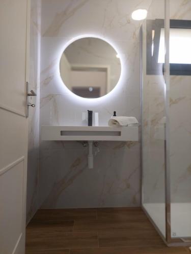 a bathroom with a sink and a mirror at RIVER VIEW TMB oporto station house in Porto