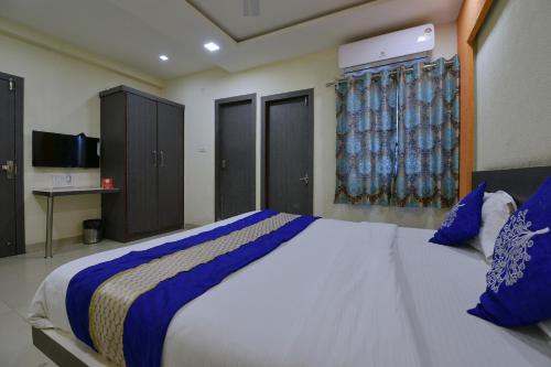 En eller flere senge i et værelse på Hotel O SVL