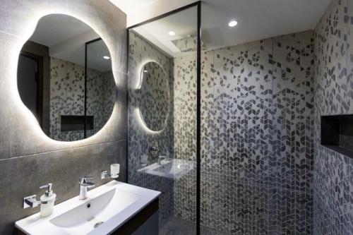 a bathroom with a sink and a shower at Madinaty B8 Lux Stay 1 in Cairo