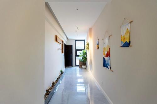 a hallway of a house with paintings on the walls at Madinaty B8 Lux Stay 1 in Cairo