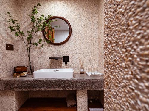 a bathroom with a sink and a mirror at Boys2men in Chongqing