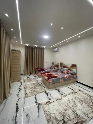 a bedroom with a bed and a marble floor at الاسكندريه كينج مريوط in King Mariout
