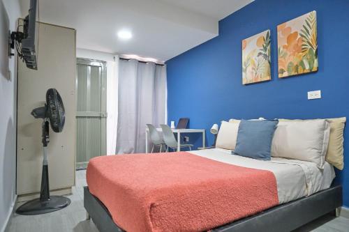Postel nebo postele na pokoji v ubytování Apartamentos y Loft en Zona Rosa de Laureles