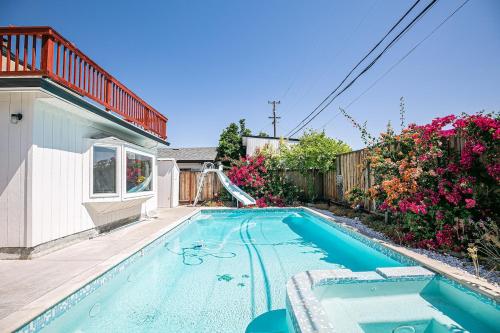 a swimming pool in the backyard of a house at Fun 3BR with Pool & Slide, Pet Friendly in San Jose in San Jose