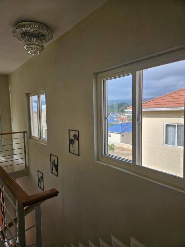 a room with a window with a view of a pool at Tranquility Loft in Ocho Rios