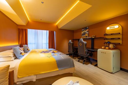 a bedroom with a yellow bed and a desk at Super Time Trendy Design Hotel Guangzhou Beijing Road Pedestrian Street Dafo Temple Branch in Guangzhou