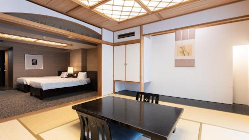 Кровать или кровати в номере Atami Season Hotel