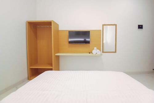 Кровать или кровати в номере Happy Living Syariah near Stasiun Klaten Mitra RedDoorz