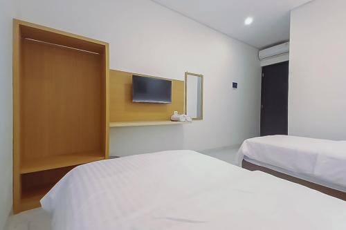 Кровать или кровати в номере Happy Living Syariah near Stasiun Klaten Mitra RedDoorz