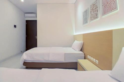 Кровать или кровати в номере Happy Living Syariah near Stasiun Klaten Mitra RedDoorz