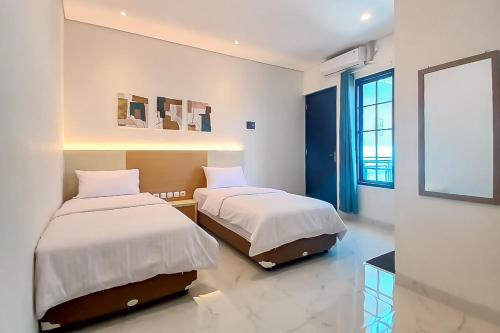 Кровать или кровати в номере Happy Living Syariah near Stasiun Klaten Mitra RedDoorz