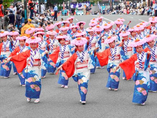 a group of children dancing in a parade at Tokyu Stay Hakata in Fukuoka