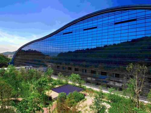 a large glass building with a lot of windows at Tokyu Stay Hakata in Fukuoka