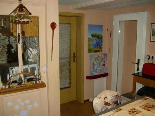 a room with a door and a room with a table at Wannenhof Romantik in Bernau im Schwarzwald