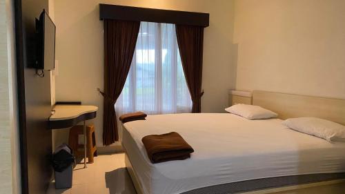Кровать или кровати в номере Hotel Terang Bulan