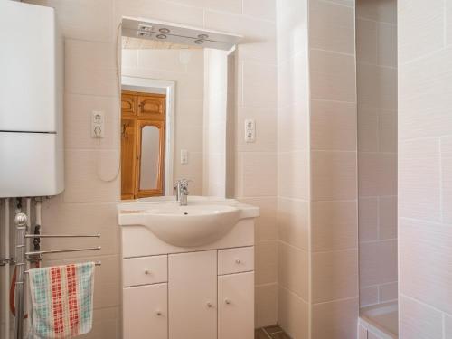 a bathroom with a sink and a mirror at Countryside Stay in Meisdorf in Meisdorf
