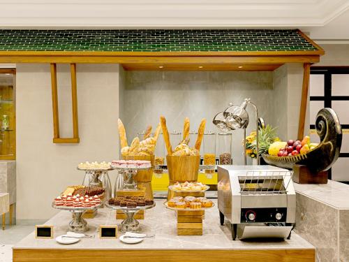 a buffet of food on a table in a kitchen at Gateway Goa, Palolem in Palolem