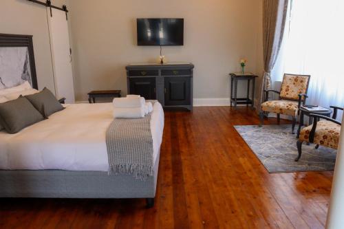 En eller flere senge i et værelse på The Essenwood Collection