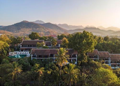 an aerial view of a resort with mountains in the background at La Résidence Phou Vao in Luang Prabang