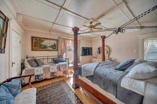a bedroom with two beds and a ceiling at Marmora and Lake Inn Honeymoon Suite in Marmora