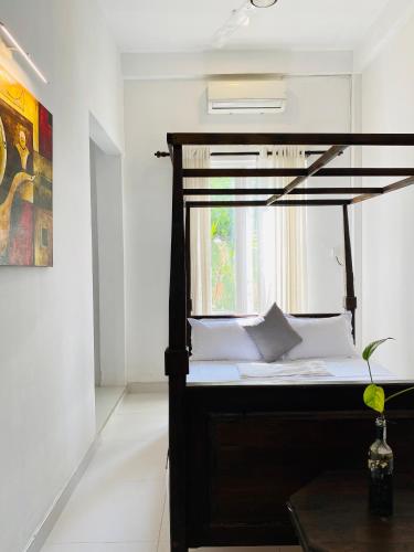 a bedroom with a bunk bed with a window at White Resort - 1 Min walk to the Beaches in Tangalle