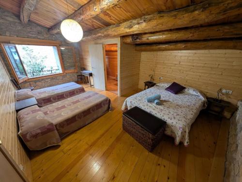 Una cama o camas en una habitación de Rustic charm in Àger, a natural paradise