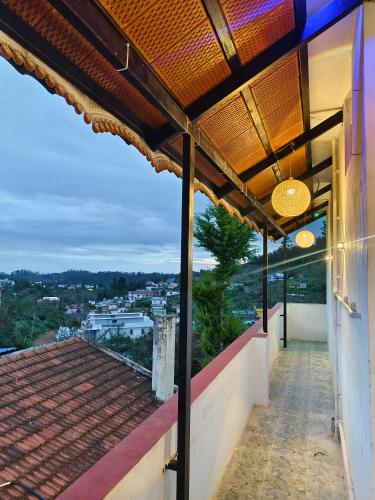 a view from the balcony of a house at Luxury Heaven Valley in Kodaikānāl