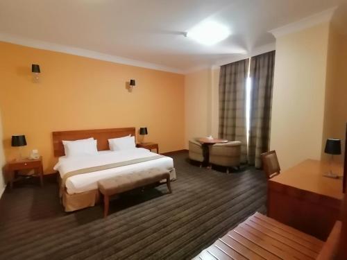 Ένα ή περισσότερα κρεβάτια σε δωμάτιο στο Al Massa Plus Hotel