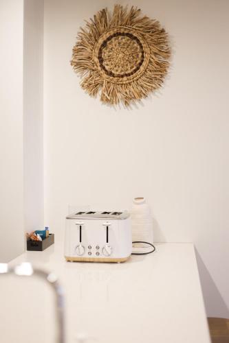 a toaster sitting on a counter in a room at Lucid Apartment South Brisbane in Brisbane