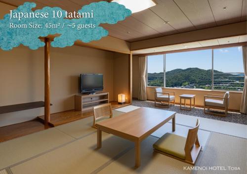 a living room with a table and chairs and a tv at KAMENOI HOTEL Toba in Toba