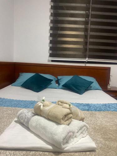 a bedroom with a bed with a towel on it at Riian Luxury Apartments in Ulcinj