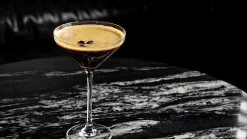a drink in a glass sitting on a table at Crowne Plaza Hangzhou Riverside by IHG in Hangzhou