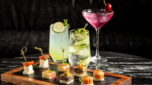 a table with a plate of food and a drink at Crowne Plaza Hangzhou Riverside by IHG in Hangzhou
