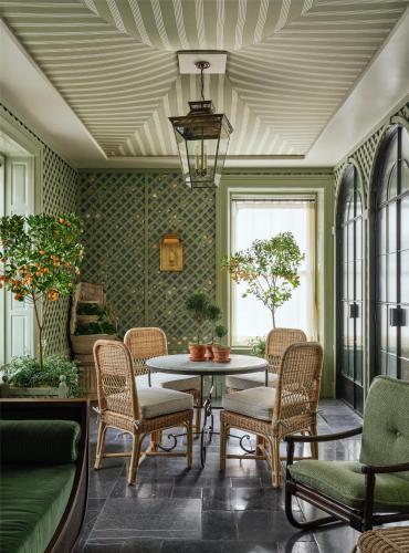 a living room with a table and chairs at The Bellevue Hotel, in the Unbound Collection by Hyatt in Philadelphia