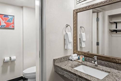 a bathroom with a sink and a mirror at Comfort Inn Largo-Washington DC East in Upper Marlboro