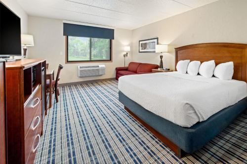 Ένα ή περισσότερα κρεβάτια σε δωμάτιο στο AmericInn by Wyndham Dickinson